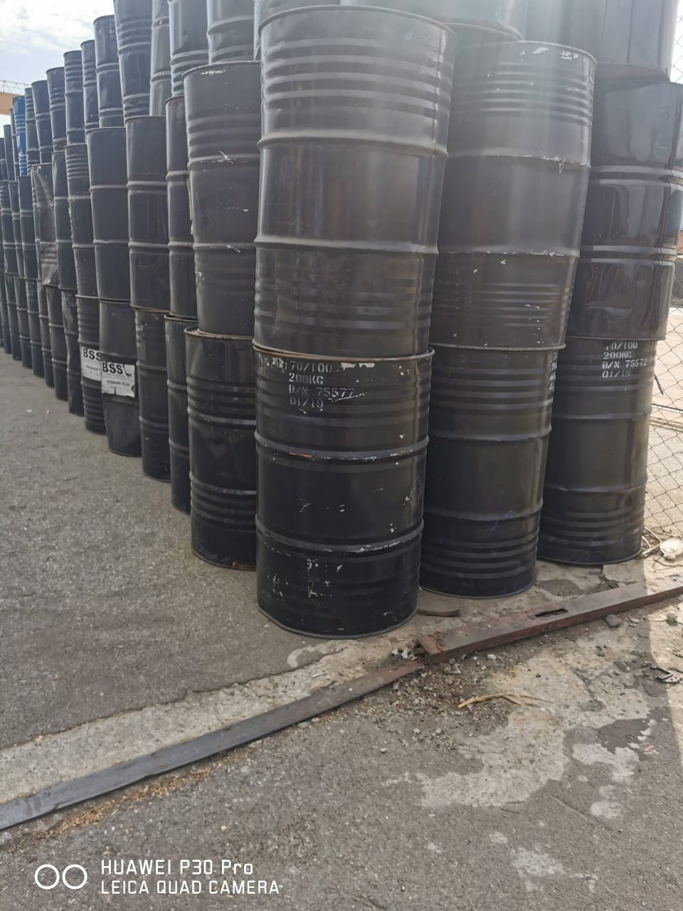 Stacked 200kg drums of 70/100 penetration grade bitumen, imported and supplied by Vebrech Civil Works